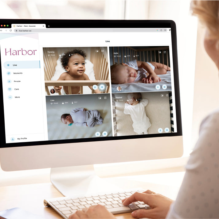 woman looking at desktop computer with Harbor app