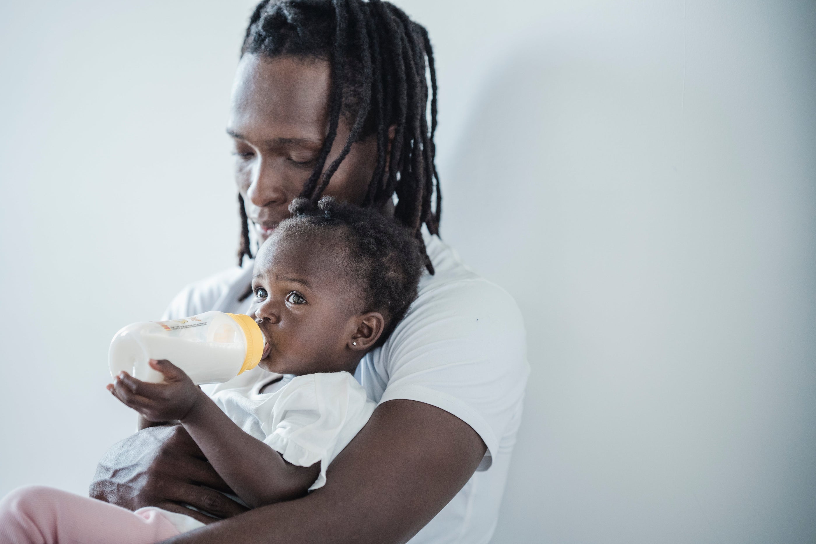 Dad feeding baby