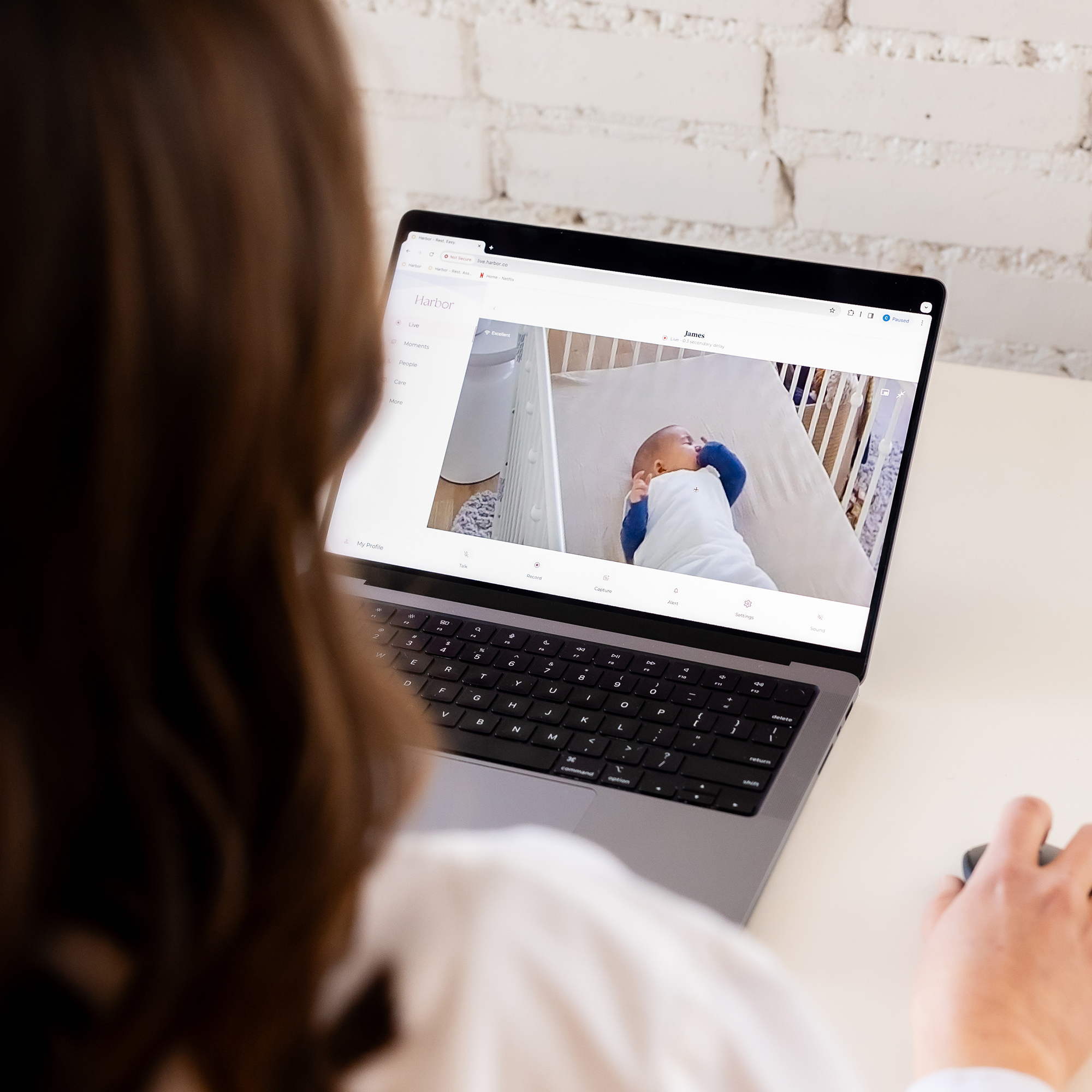 Remote Care Member looking at monitor on laptop